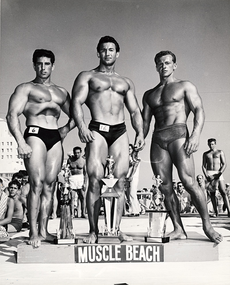Lot 4111, Auction 126, Bruce of L.A., Three winners of bodybuilding contest, Muscle Beach, Santa Monica: Charles Collras, Hossein Shokouh und Jerry Boily; Nude of John Manning